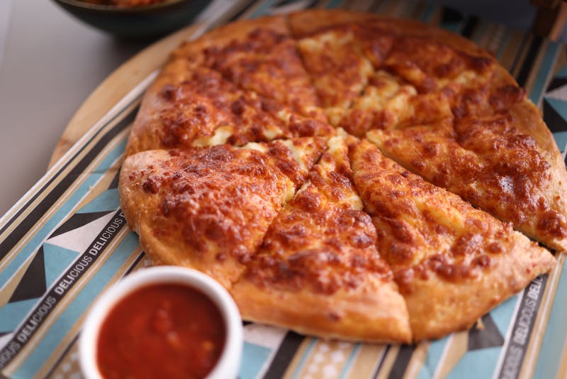 Crispy cheese breadsticks with marinara dipping sauce