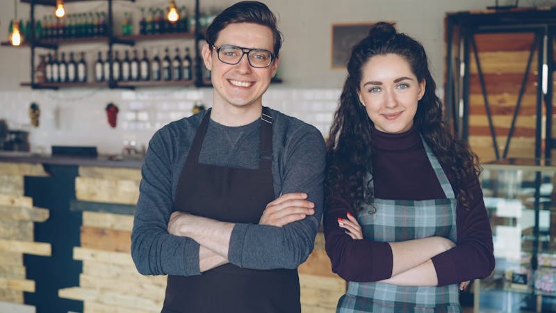 Imos Pizza team members collaborating in the restaurant